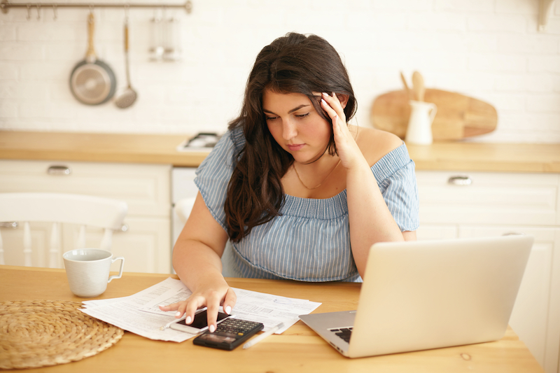 Young woman calculating finances